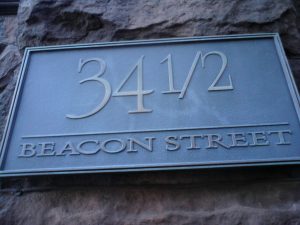 An address plaque for 34 1/2 Beacon Street