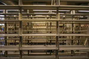 A totally neutral, and thus totally empty, set of library shelves. Photo Credit: Jeffrey Beall, used under Creative Commons