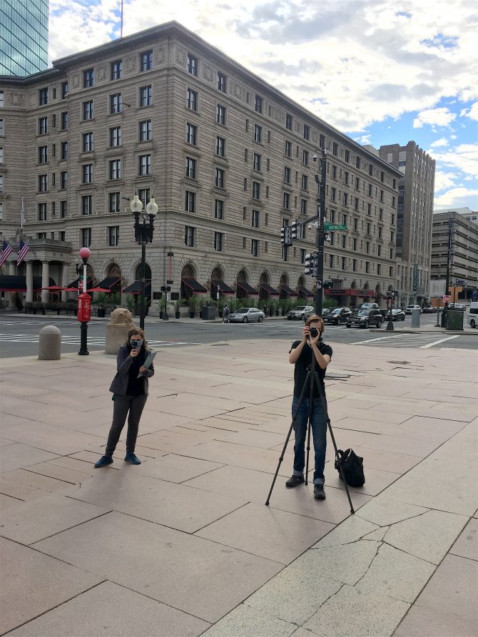 Members of BPL's Audio/Visual team film the McKim highlights tour on the Dartmouth plaza.
